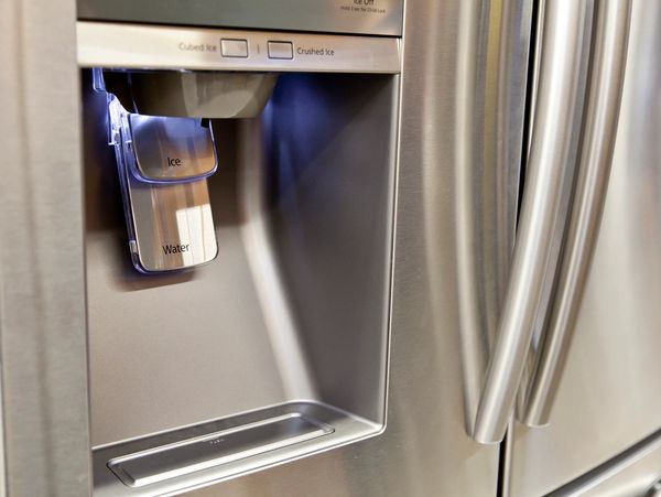 A picture of water purifier on the refrigerator