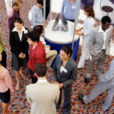 Professionals networking and engaging in a business event.