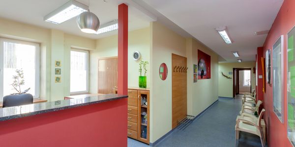 hallway and chairs in commercial office building showing types of facilities cleaned and porter serv