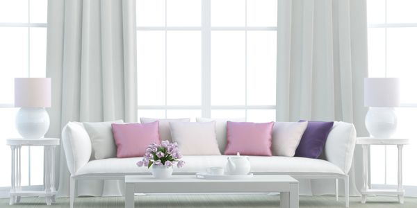 A sofa with a set of pillows