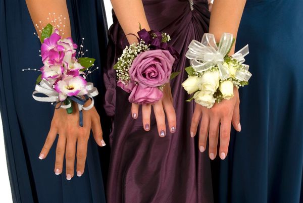 Three floral wrist corsages