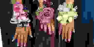 Three bridesmaids' hands.