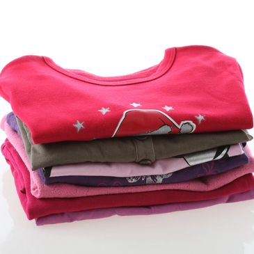 A stack of neatly folded t-shirts.