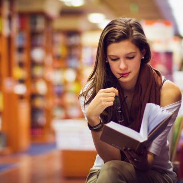 Woman reviewing book, Line of Communications