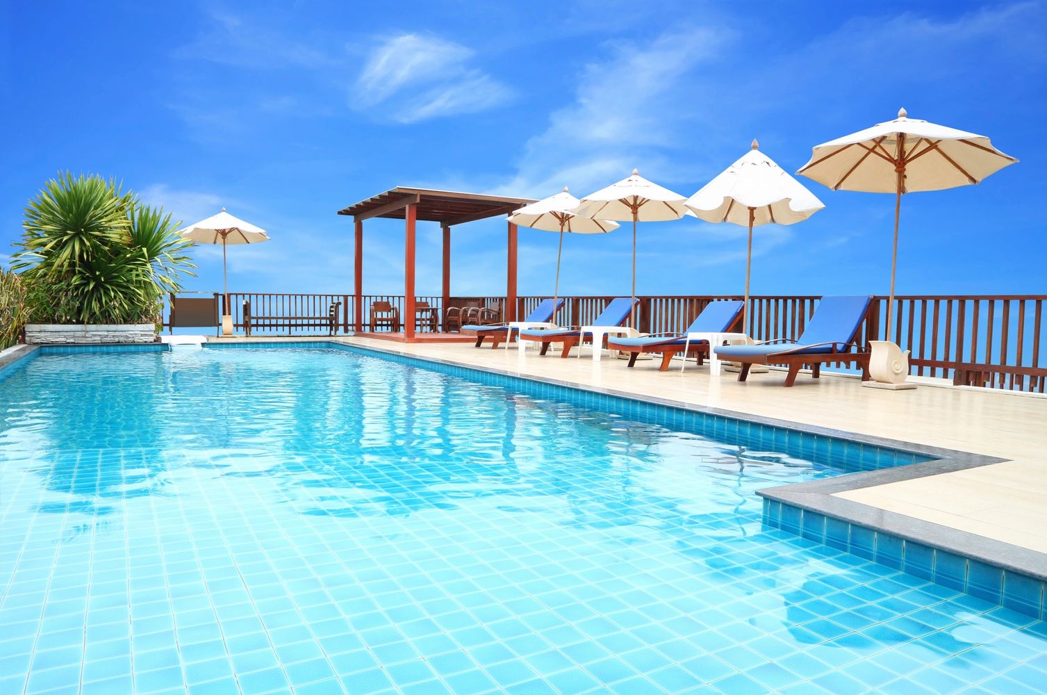 Clean swimming pool with blue tile
