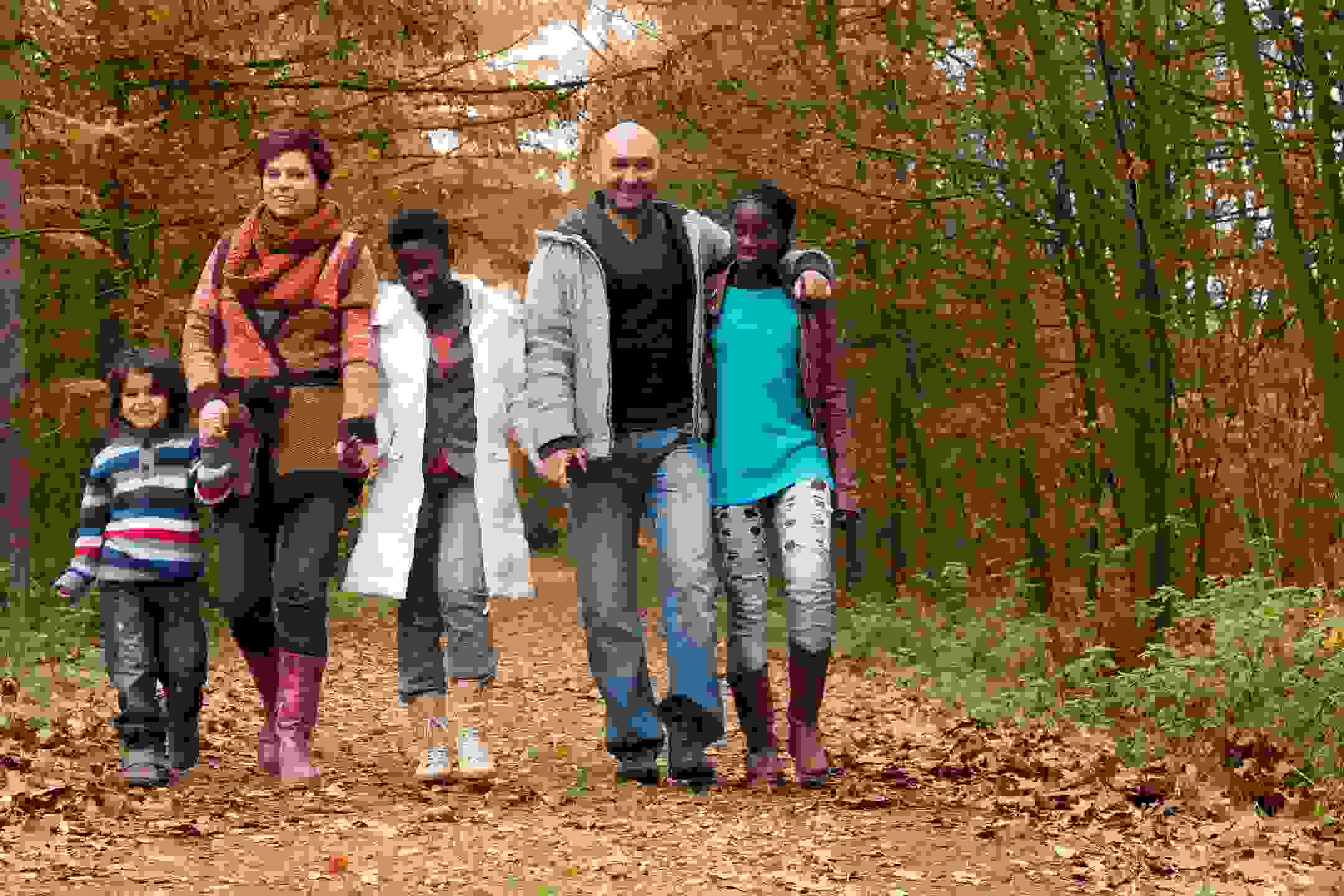 Mixed family, adoptive family, happy family, family walking trail together