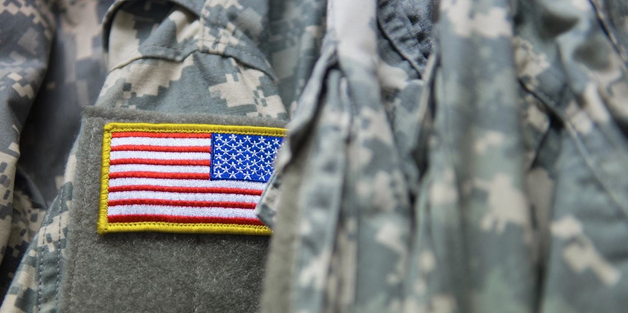 Close-up of a U.S. flag patch on military uniform.