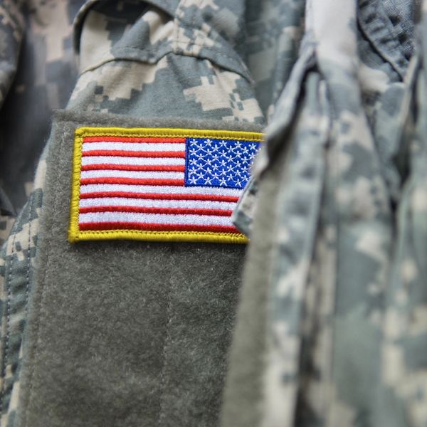 Close-up of a U.S. flag patch on a military uniform.