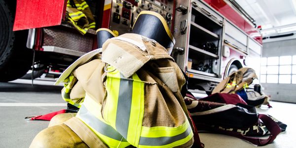 Firefighter boots and coat in fire station