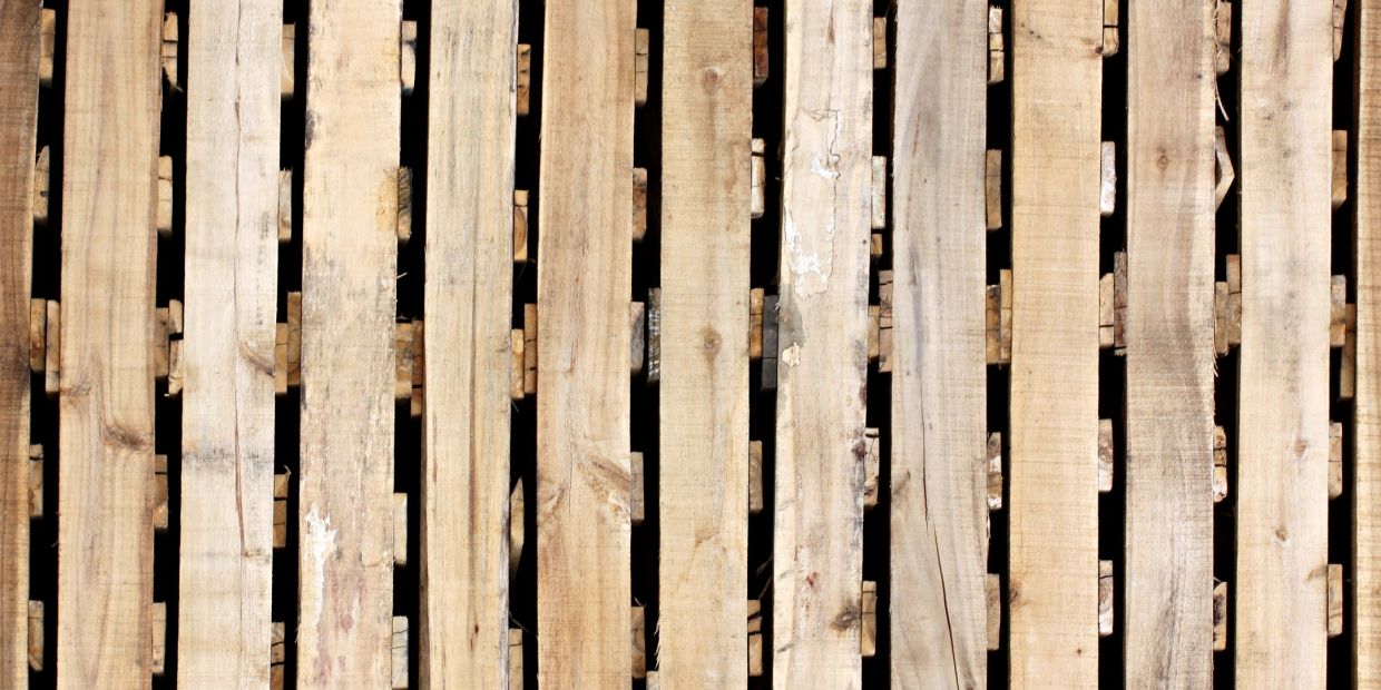 Close-up of wooden slats with gaps in between.