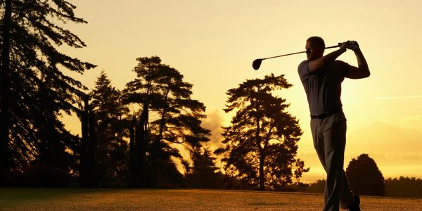 Man golfing with improved energy after testosterone treatment