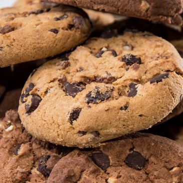 Close-up of chocolate chip cookies stacked together.