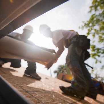 two roofer repairing a roof in Bath