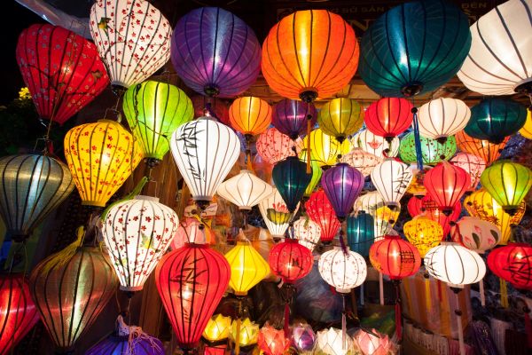Colorful traditional lanterns glowing at night.