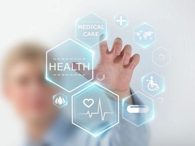 Person interacting with futuristic health and medical care icons in digital interface.