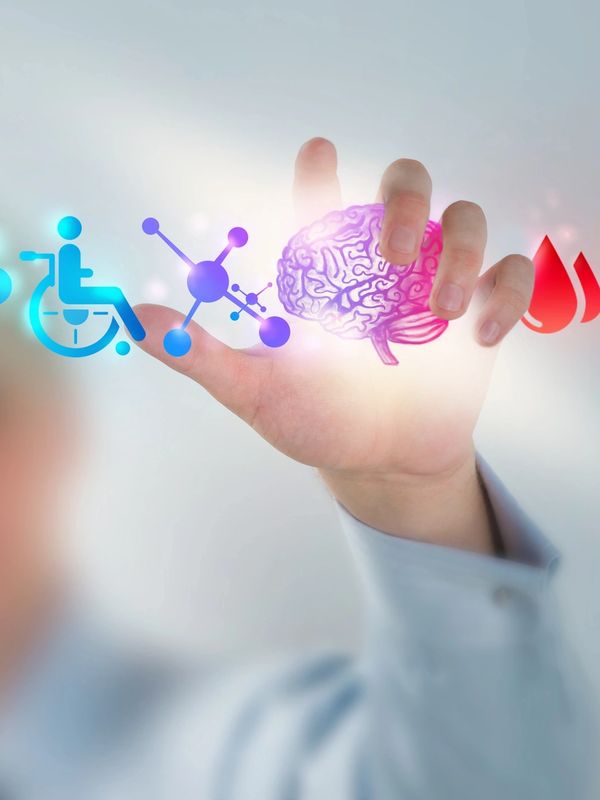 Hand interacting with glowing health and science icons, including a brain and wheelchair symbol.