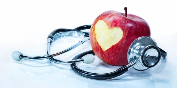 ICARENP AND APPLE WITH HEART IN THE CENTER WITH A ICARENP STETHOSCOPE SURROUNDING THE HEART TO INDIC