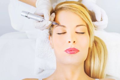 Woman receiving a permanent makeup procedure
