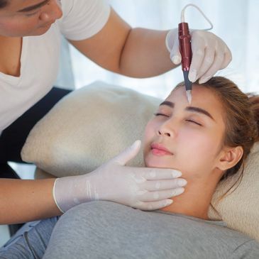 A client receiving a facial treatment with doctor