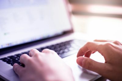 Person searching on the computer to find legal services 