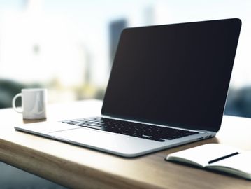 Laptop computer and desk for online Telehealth appointments 