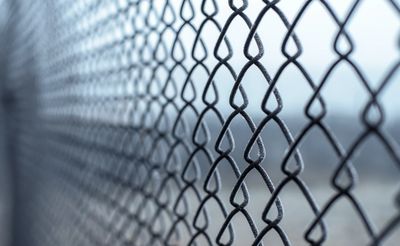 Chain-link fences can add a nice touch around your pool area. 