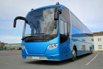 Typical motor coach (tour bus) used for step-on and over-the-road tours.