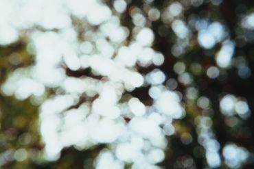 Abstract bokeh background with circular light spots.