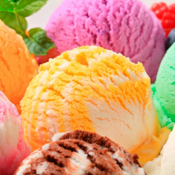 Colorful scoops of ice cream in various flavors close up.