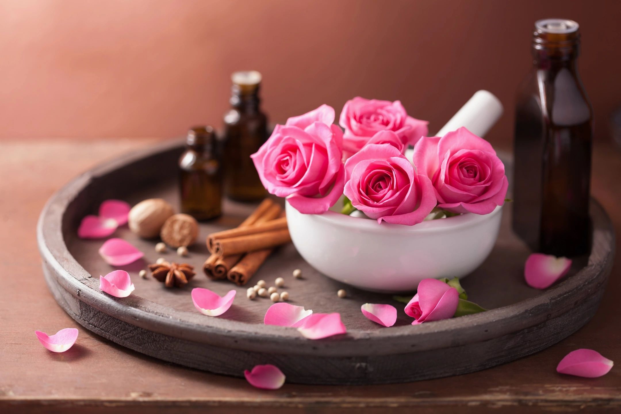 essential oils with flowers and petals