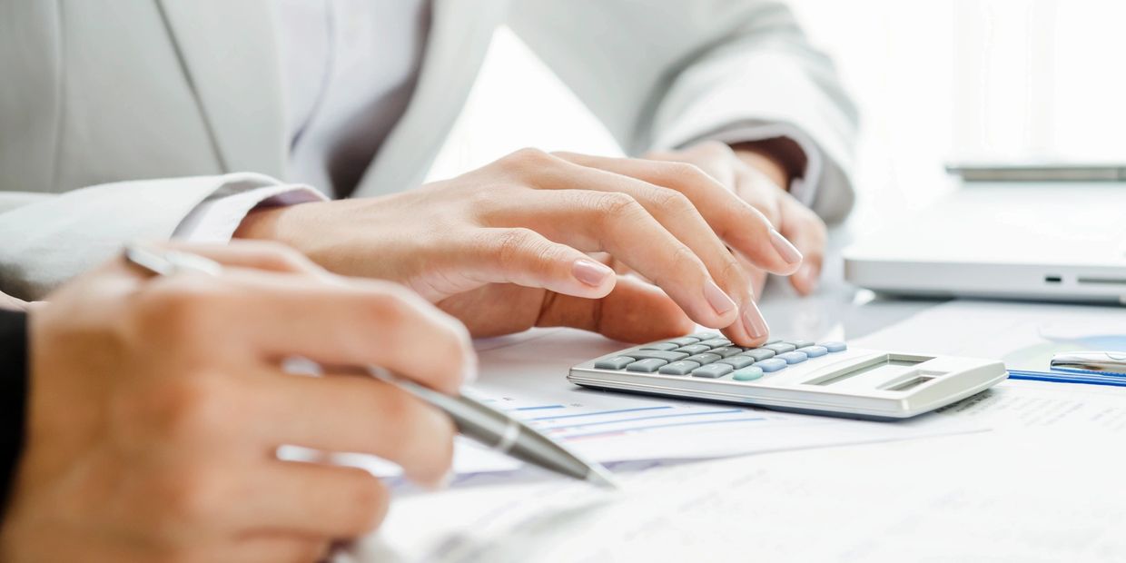 A bookkeeper reviewing balance sheets