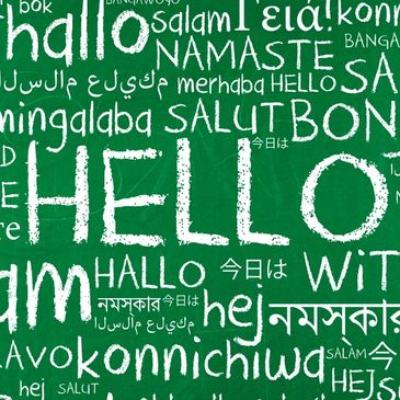 Stock image of a speech bubble made of hellos in different languages.