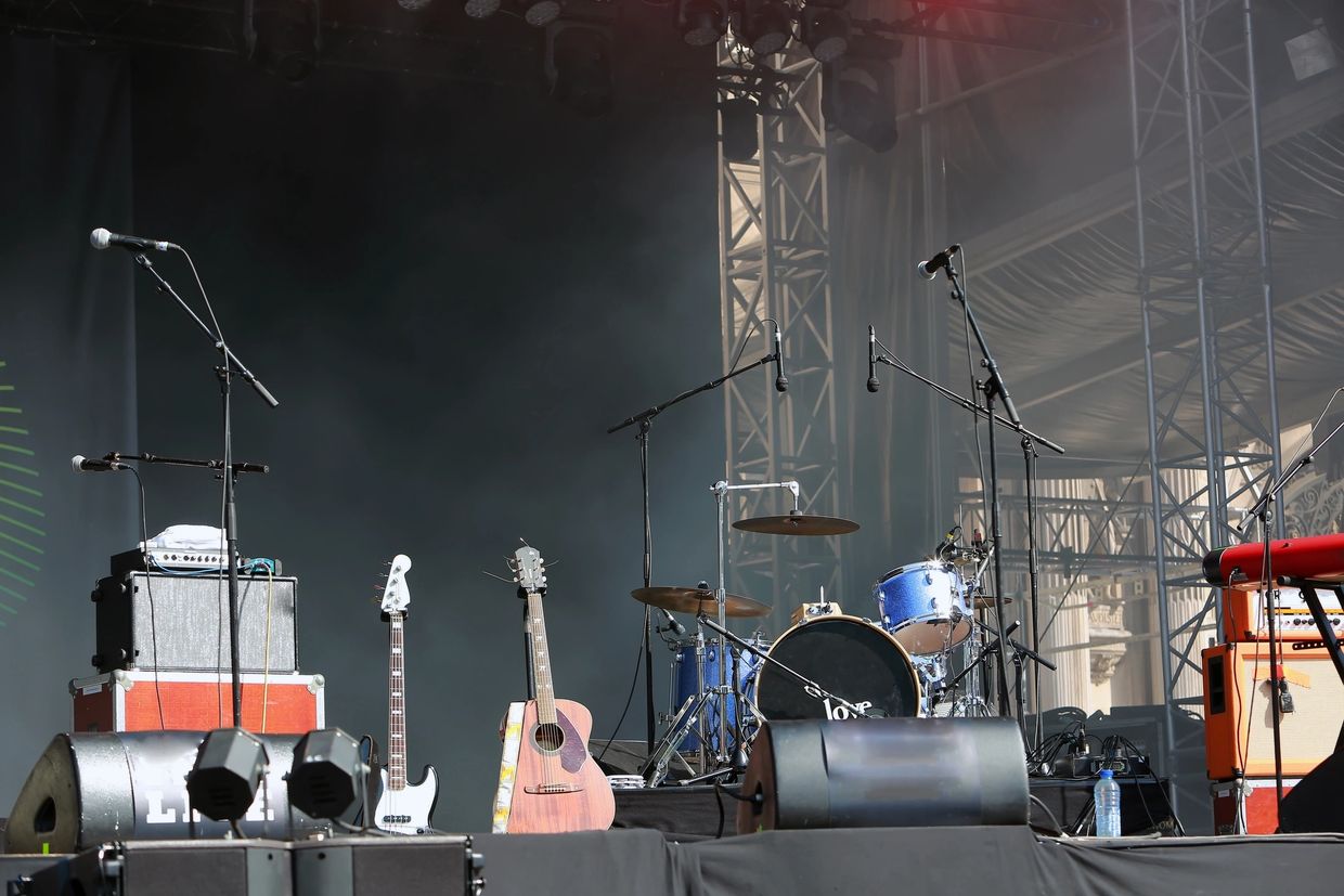 Various musical instruments on a stage ready for a music lesson.