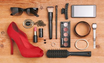 Product photography of various beauty items, watch, bracelets, glasses, brush and a shoe