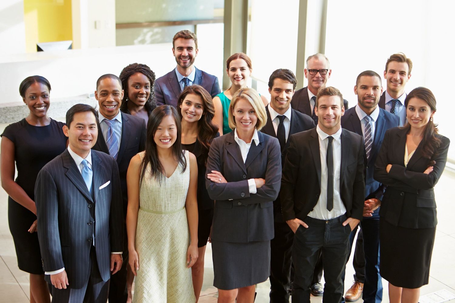 Image of a large group of business people smiling