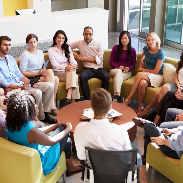 An in-person group coaching session