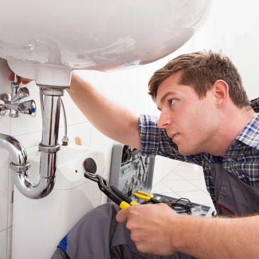 Plumber  repairing pipes