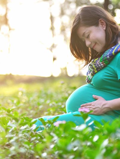 pregnant woman in field of flowers