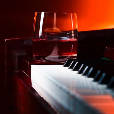 Piano keys and cocktail.
