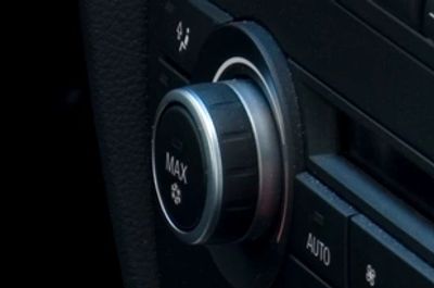 Close-up of car climate control knob set to max.