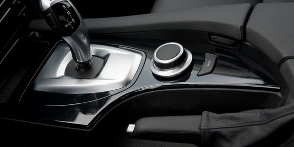 A vehicle interior showing an automatic transmission gear lever