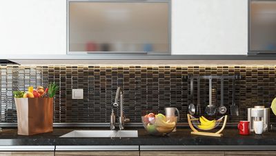A kitchen with a sink and a counter top