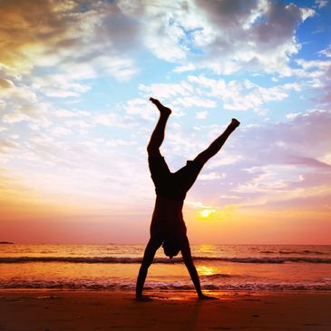 A handstand at a sunset