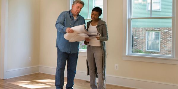 a project manager reviewing a project with a homeowner