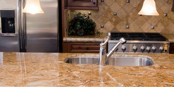 Brown granite kitchen worktop with undermounted sink