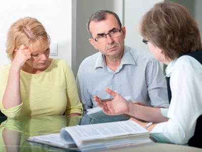 A couple amicably engaged in negotiating their divorce settlement agreement