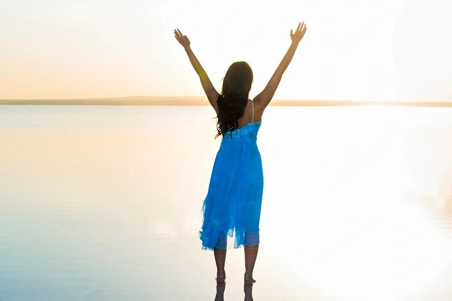 Success image - woman with arms raised