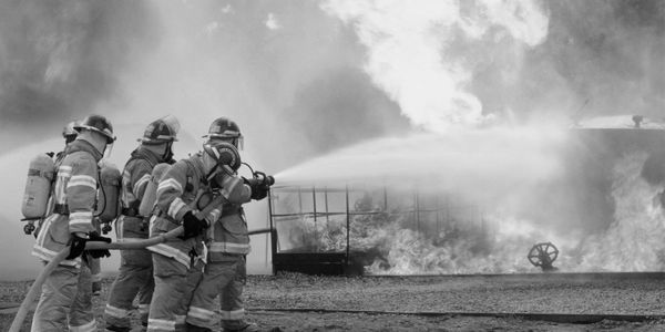 Fire Fighters putting out house fire