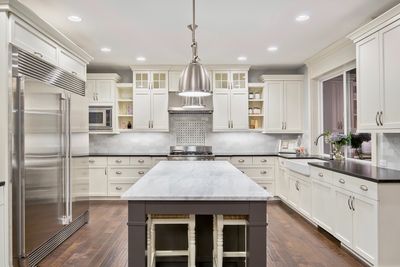 Kitchen Remodel Puyallup tacoma white shaker quartz construction contractor stainless appliance ligh