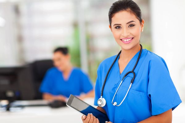 Nurse holding a tablet image.